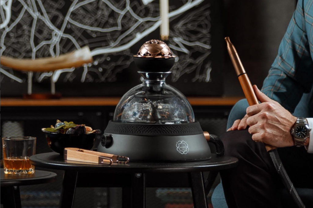 Luxurious hookah setup with glowing coals and aromatic shisha smoke.