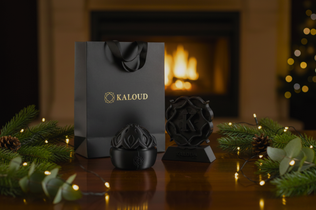 Kaloud limited-edition puzzle and cube displayed with Kaloud gift bag in holiday setting, part of the 12 Days of Kaloud giveaway campaign