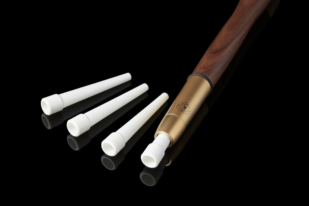 Kaloud Cybele compostable mouth tips beside a Kaloud Aeolis Auris hookah hose, with one tip seated in the handle