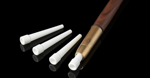 Kaloud Cybele compostable mouth tips beside a Kaloud Aeolis Auris hookah hose, with one tip seated in the handle