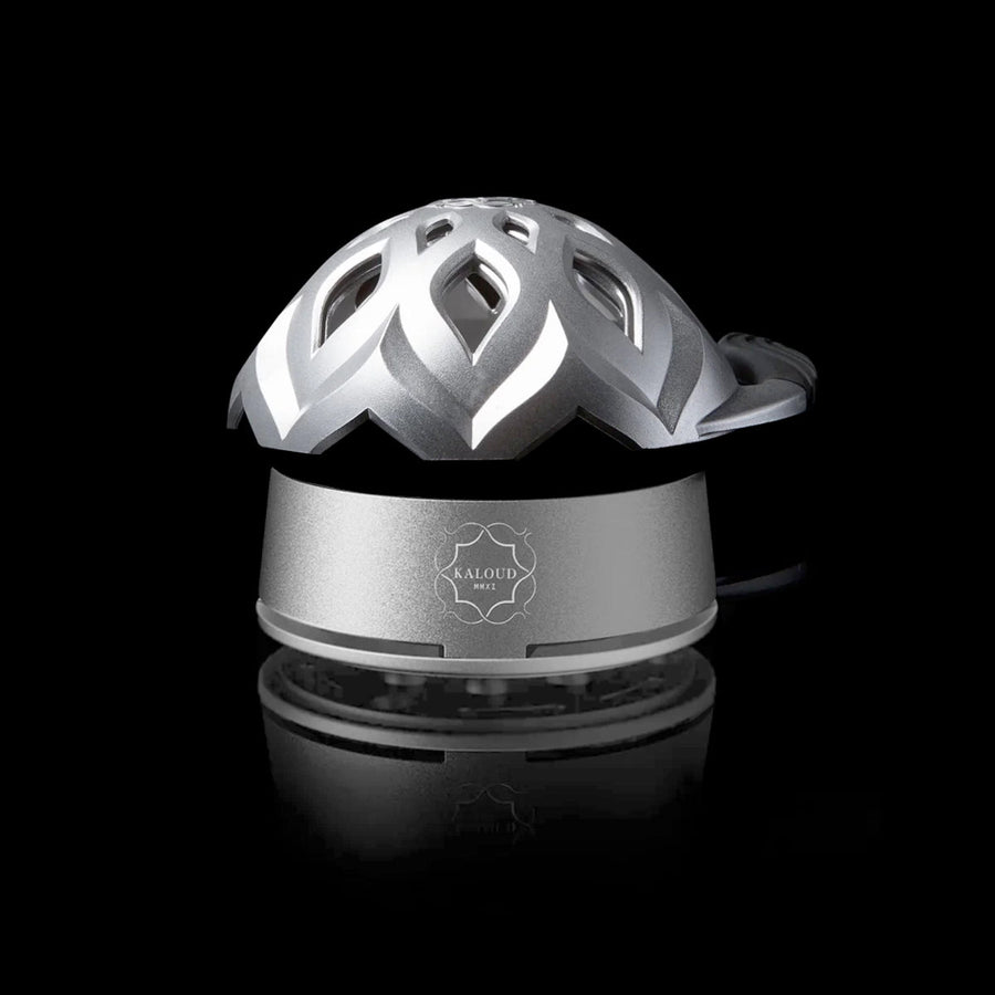 Kaloud Lotus I+3 Stainless Steel heat management device with open petal lid on a black background
