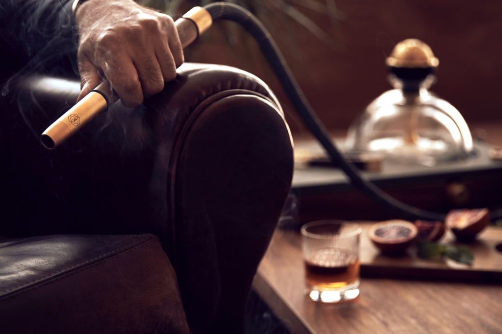 Hookah lounge session showing prolonged nicotine exposure through repeated inhalation and smooth airflow system