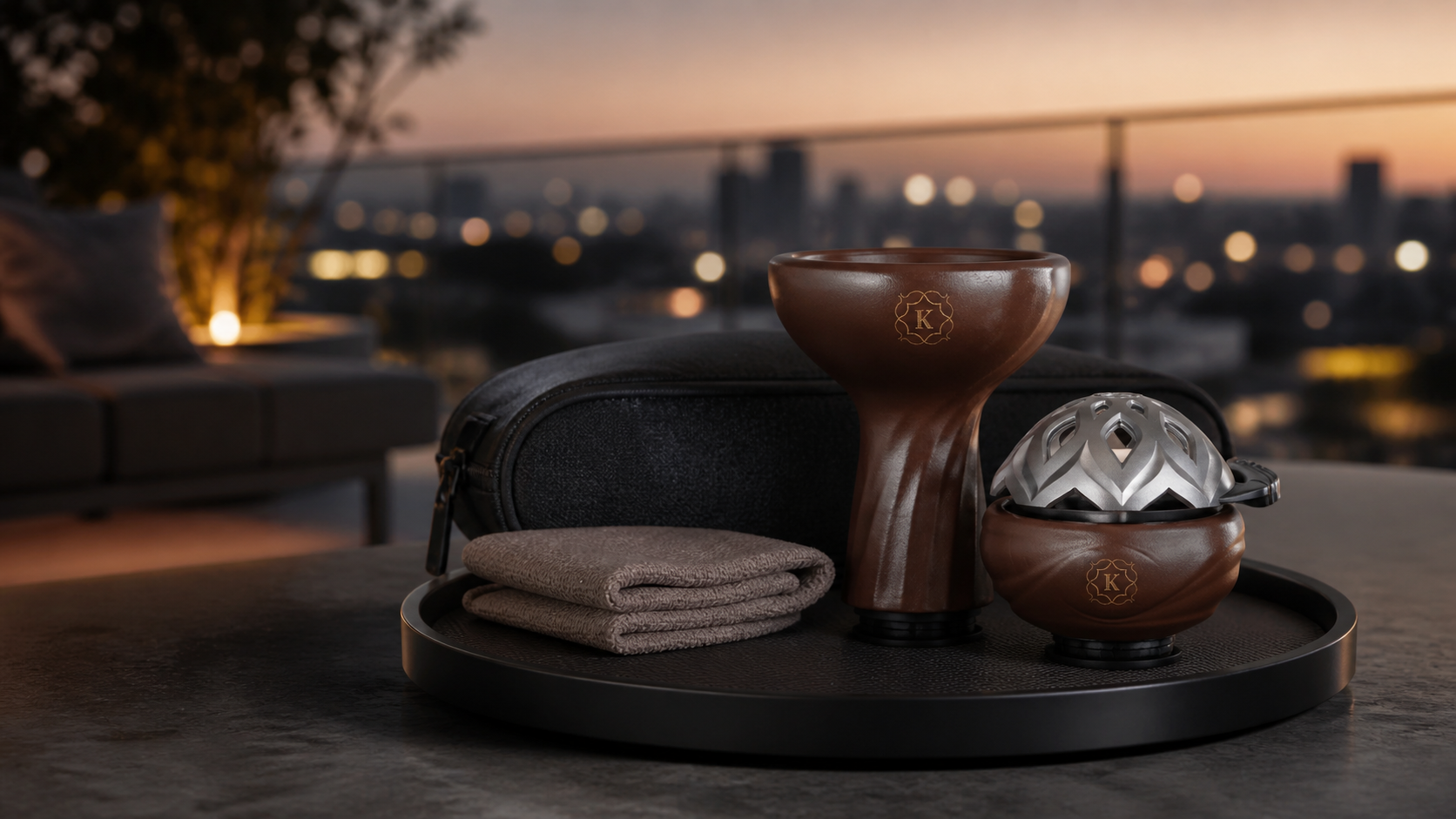 Kaloud Lotus 3 heat management device and Kaloud clay bowl on a refined travel tray at dusk, presented as a premium portable hookah setup