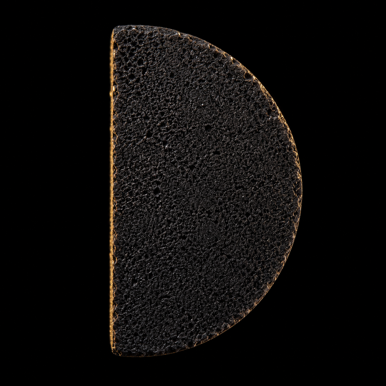 Kaloud Aura® Premium Coconut Charcoal Half Moon Cut piece close-up with Aura Premium Charcoal box on black surface