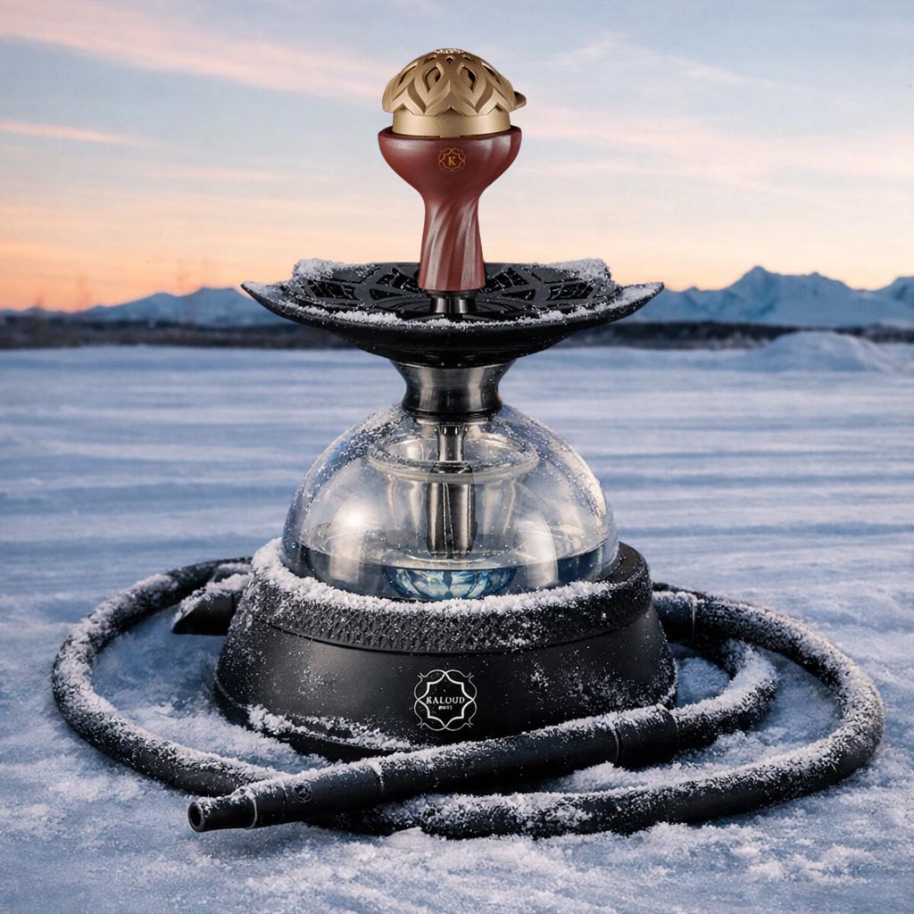 Kaloud Black Eltheria hookah bundle on snowy mountain surface with sunset alpine backdrop – dramatic winter premium hookah lifestyle photography